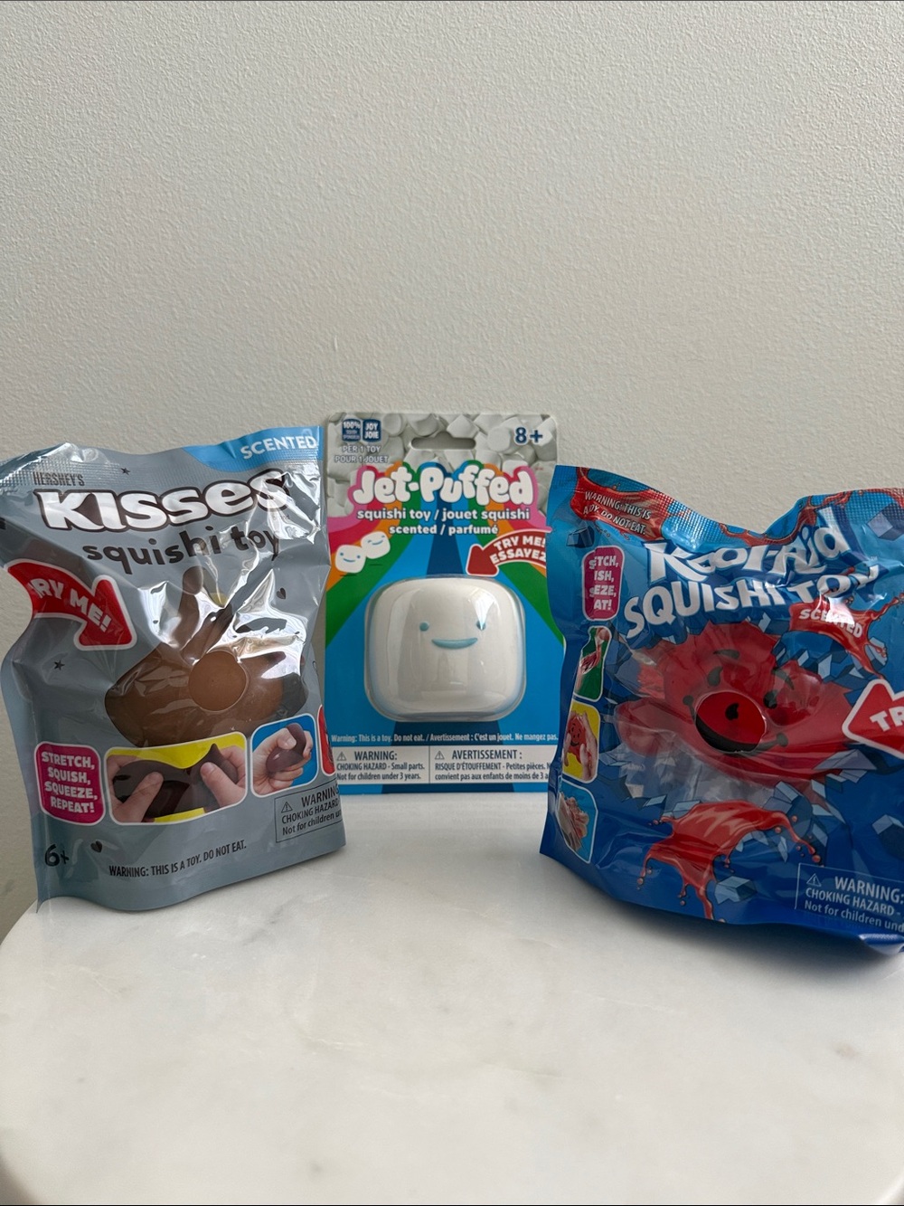 Jet Puffed Marshmallow, Hersheys Kisses, and Kool Aid Squishi Toy